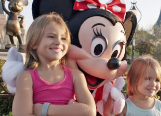 2 little girls pose for a photo at Disney World – Now Look closely at Minnie Mouse