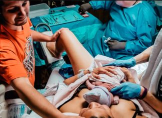 Photographer Pictures Father With Tears After Watching Newborn Only He Claims “That’s Not Why I Was Crying”