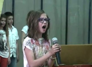 Timid little girl steps up to mic. Within seconds, entire school is blown away with her flawless voice