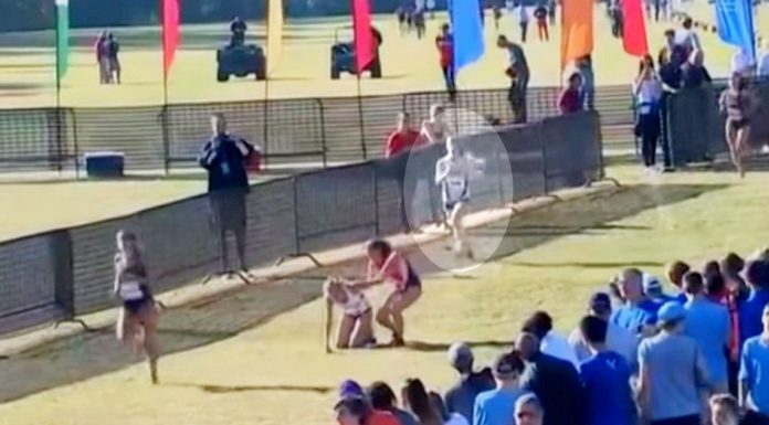 Kind runners step in to help girl on competing team