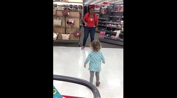 Target employee challenges little girl to a dance off