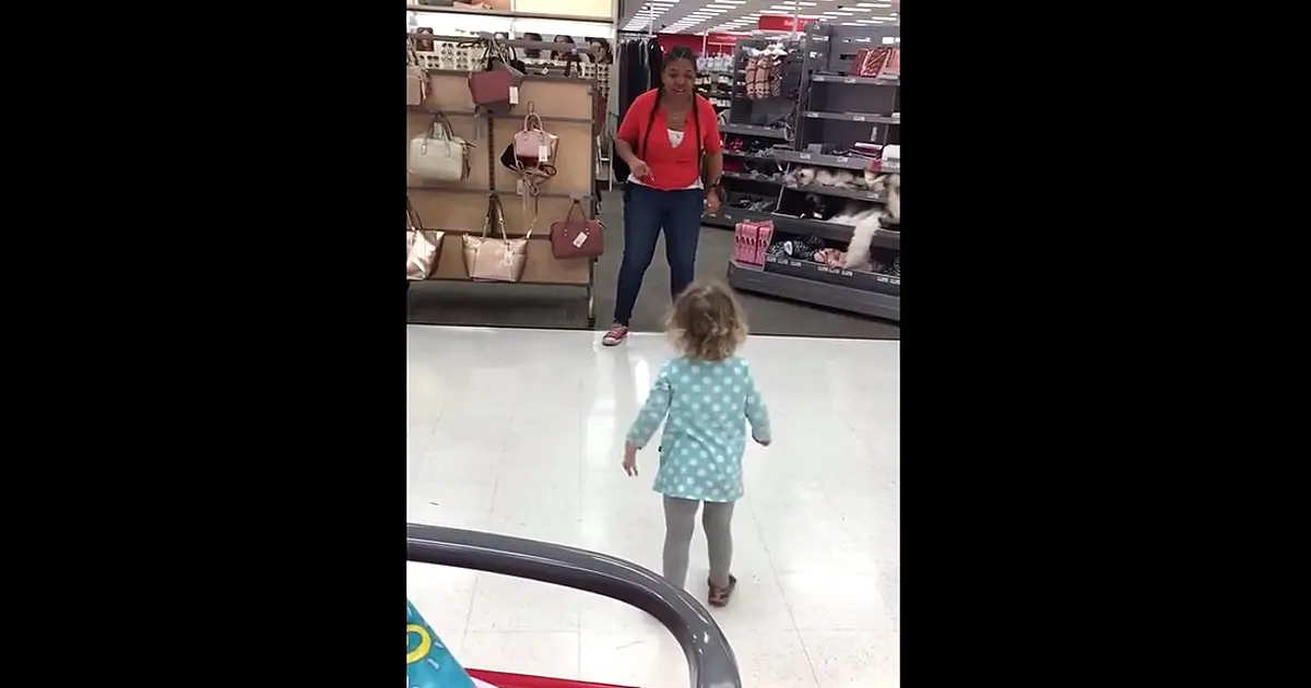 Target employee challenges little girl to a dance off