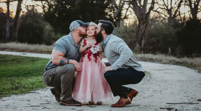 Truth turns heads when dad and step-dad pose with daughter