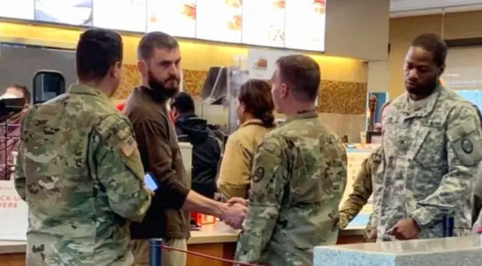 Dad surrounded by a group of soldiers at Chik-Fil-A jumps into action with desperate plea