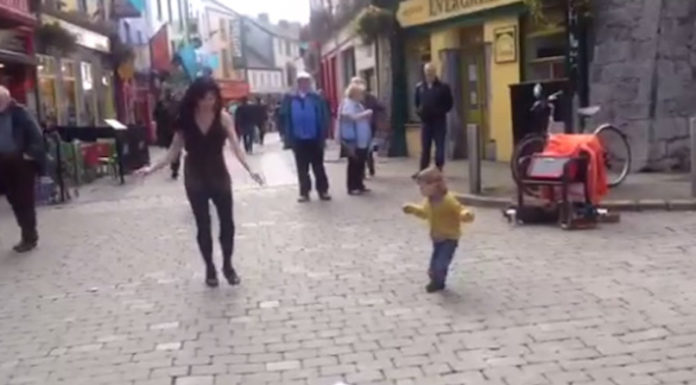 Adorable toddler sees a woman Irish dancing in the streets and decides to join in