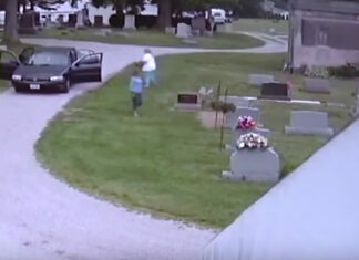 Women approach tombstone thinking no one can see, only there’s a camera trained on them