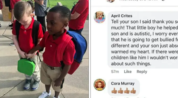 Little boy holds hand of a crying classmate