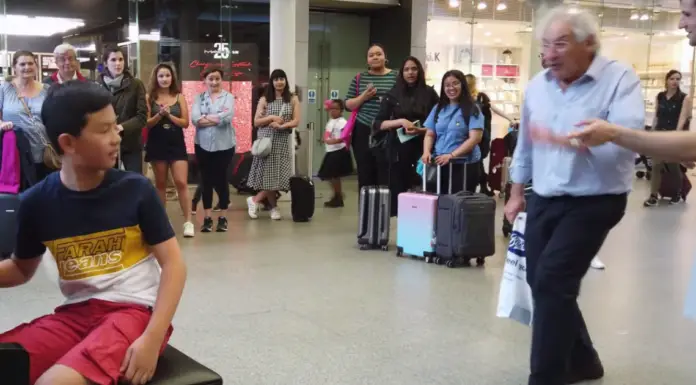 Boy draws huge crowd as he plays Queen hit on a public piano