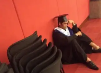Student barely holds back tears when family skips his graduation
