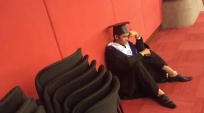 Student barely holds back tears when family skips his graduation