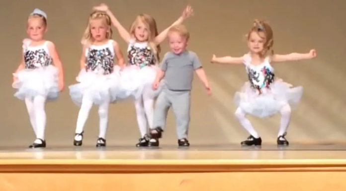 Toddler interrupts a recital – His moves make the show better