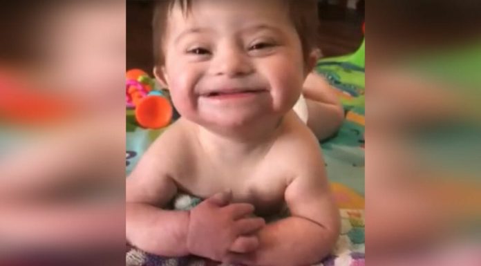 Adopted baby with Down Syndrome smiles for her new mom