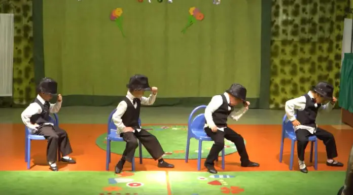 Four preschoolers dress in suits and wow the crowd with their chair dance performance