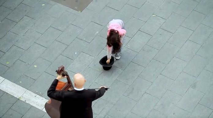 Little Girl Puts Money in Hat and Starts Chill Inducing Flash Mob