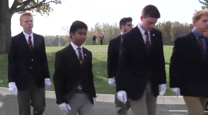 Detroit students step in for deceased homeless veterans and carry their caskets to grave