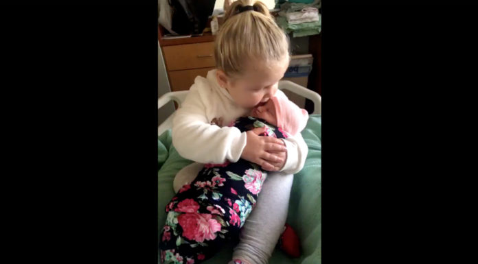 3-year-old sibling is overjoyed to meet and hold newborn baby sister for the first time