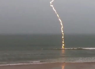 Man was shooting the ocean during a storm and caught an incredible footage of a lighting striking