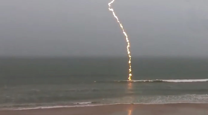 Man was shooting the ocean during a storm and caught an incredible footage of a lighting striking