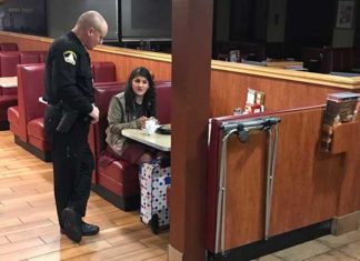 Police officers spot a woman sitting at a parking lot all by herself- offer her a lift and buy her a ticket home