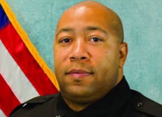 Police officer shot dead after argument over a face mask escalated during a high school basketball game