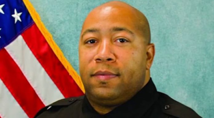 Police officer shot dead after argument over a face mask escalated during a high school basketball game