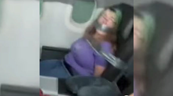 Woman duct-taped to seat after trying to open plane door mid-flight