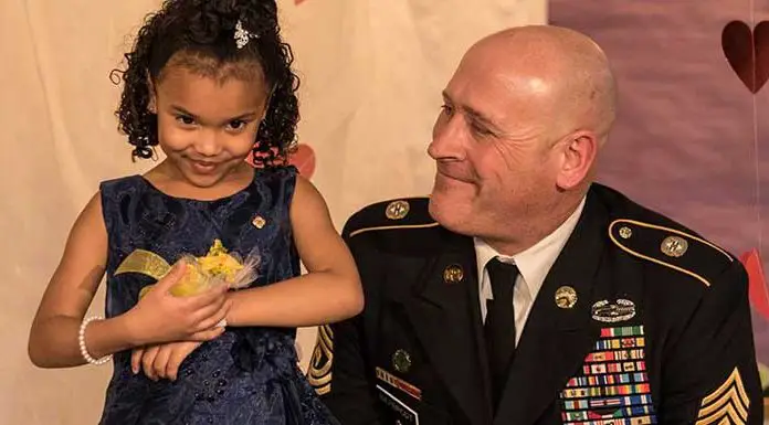 National guard soldier escorts kindergartner to her father-daughter dance