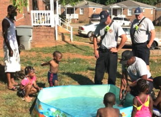 Firefighters lend a helping hand when noticing mom filling her kids’ pool with a pot