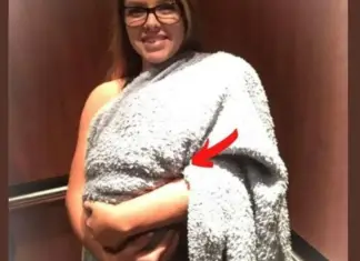 A woman enters the hospital with a blanket-covered bundle, assumed to be a child- When she reveals it, the staff falls silent