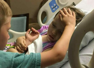 The story behind a heartbreaking image of a 6-year-old boy saying goodbye to his dying sister