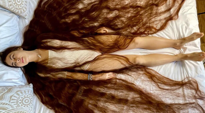 With 90-inches of flowing brown locks, this real life Rapunzel has hair brushing the ground behind her