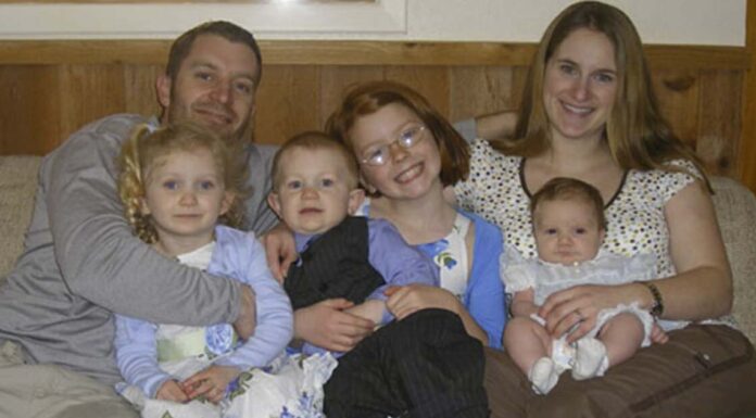 Weird! This looks like a regular family photo until you see what’s underneath mom