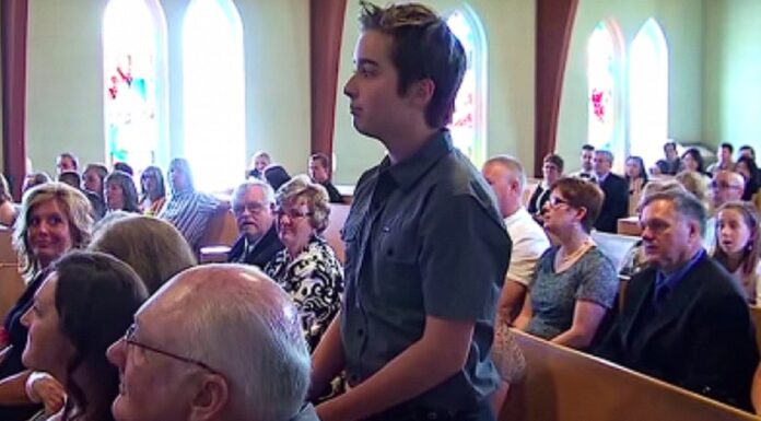 Boy stands up during wedding ceremony to give groom the surprise of his life