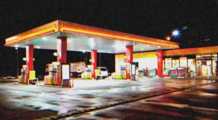 Dirty elderly lady runs into a gas station on rainy night, screaming for help