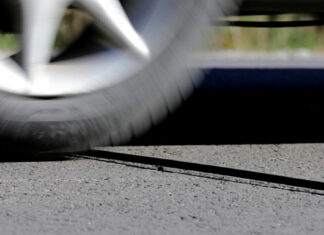 The purpose behind those mysterious black cables on the road