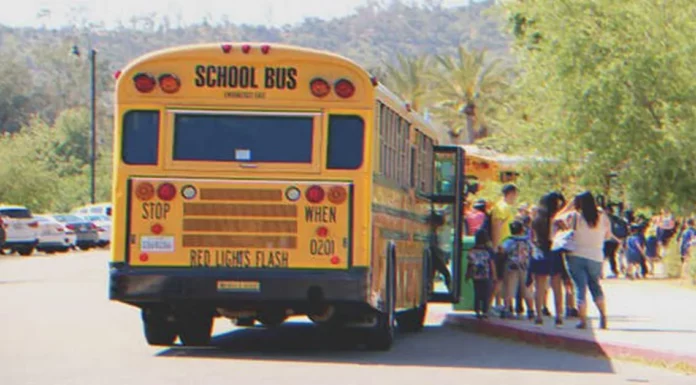 Kids bully poorly dressed girl on school bus