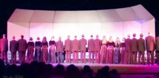 Choir begins singing ‘Lone Ranger’ theme with backs to the crowd