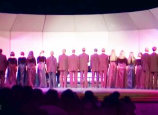 Choir begins singing ‘Lone Ranger’ theme with backs to the crowd
