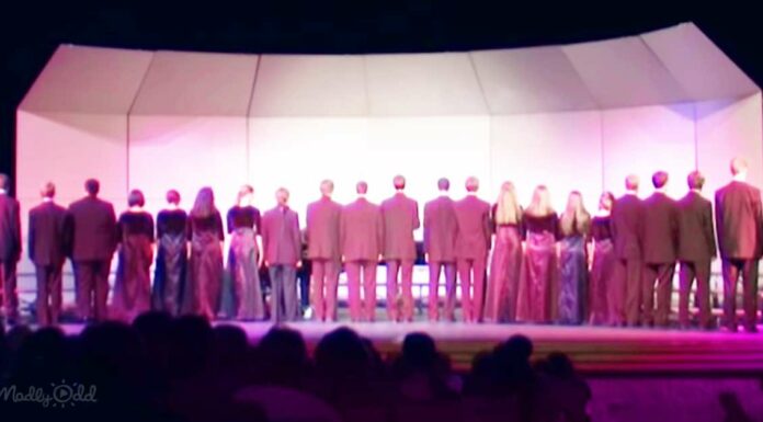 Choir begins singing ‘Lone Ranger’ theme with backs to the crowd