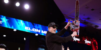 Elon Musk wields chainsaw on stage as ex sends him grim message